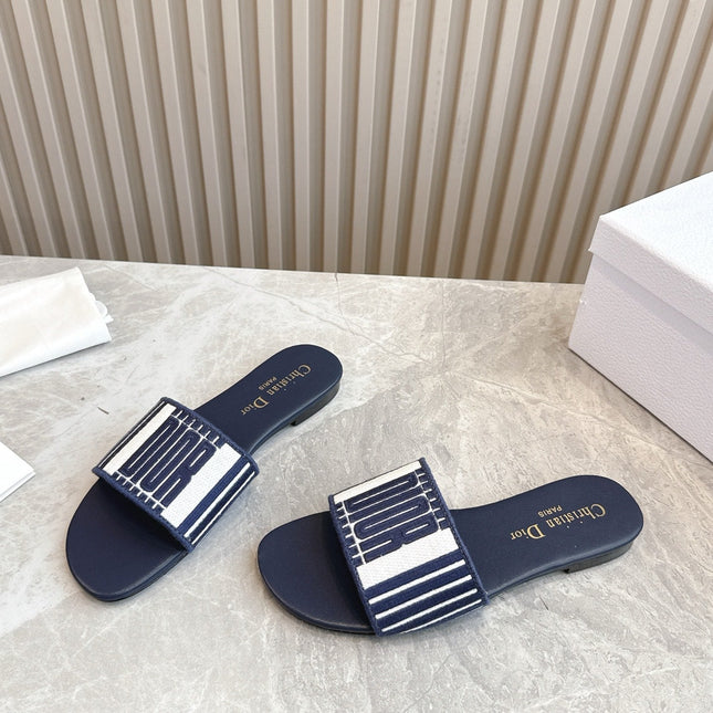 DIOR FLAT SLIDES 25S IN MIDNIGHT BLUE CALFSKIN AND FABRIC BRAND NAME EMBROIDERY
