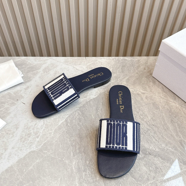 DIOR FLAT SLIDES 25S IN MIDNIGHT BLUE CALFSKIN AND FABRIC BRAND NAME EMBROIDERY
