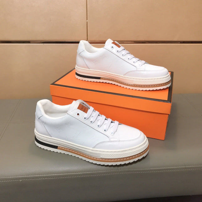 LV TRAINER IN EMBOSSED WHITE SUEDE