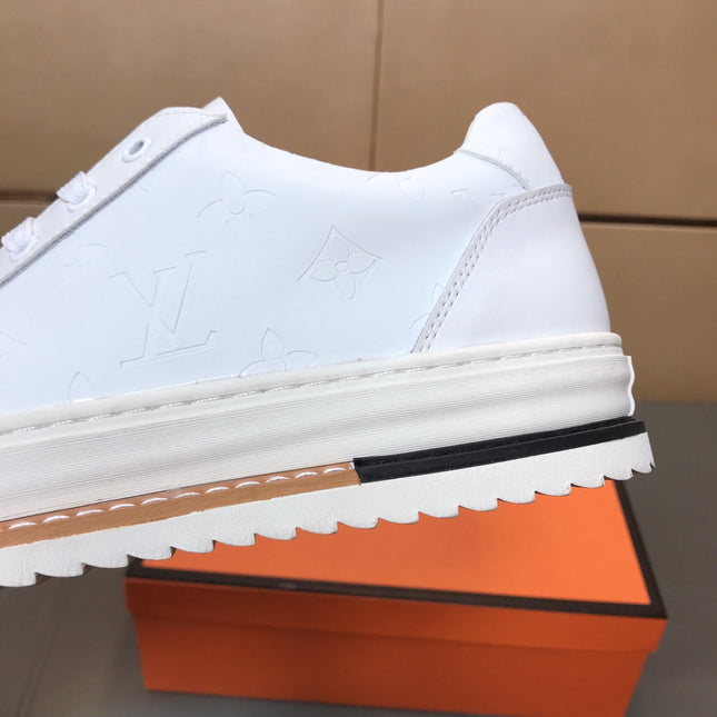 LV TRAINER IN EMBOSSED WHITE SUEDE