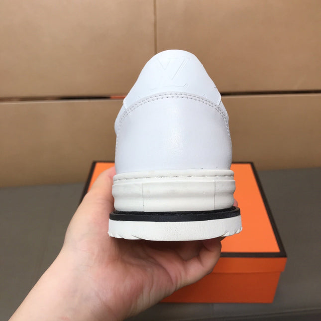 LV TRAINER IN EMBOSSED WHITE SUEDE