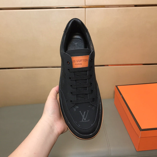 LV TRAINER IN EMBOSSED BLACK SUEDE