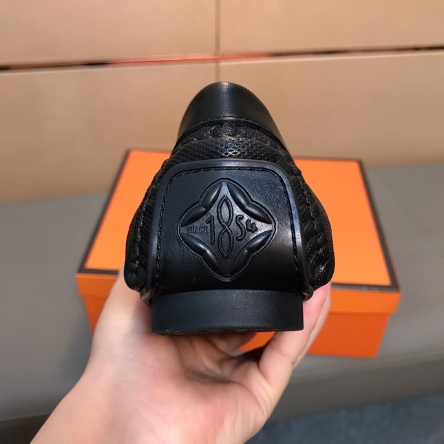 LV LOAFERS IN BLACK CALFSKIN WITH BRANDED EMBOSSING