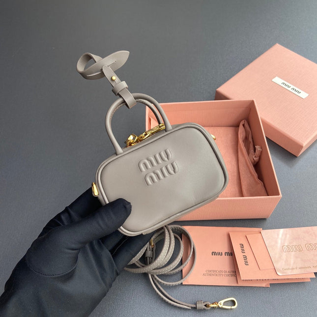 MICRO BAG KEYCHAIN 11 IN CLAY GREY CALFSKIN GOLD HARDWARE EMBOSSED LOGO