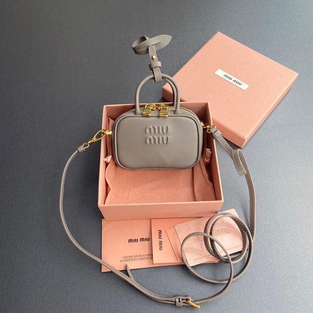 MICRO BAG KEYCHAIN 11 IN CLAY GREY CALFSKIN GOLD HARDWARE EMBOSSED LOGO