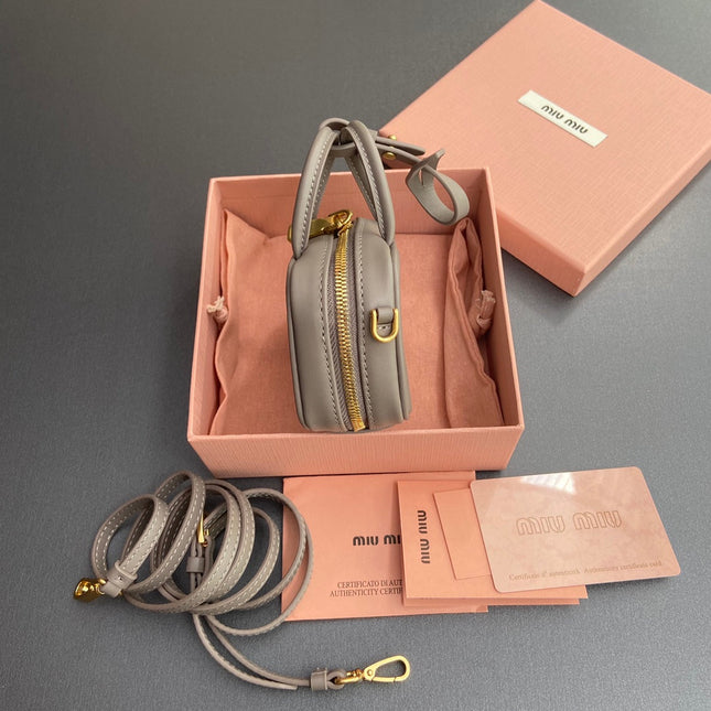 MICRO BAG KEYCHAIN 11 IN CLAY GREY CALFSKIN GOLD HARDWARE EMBOSSED LOGO