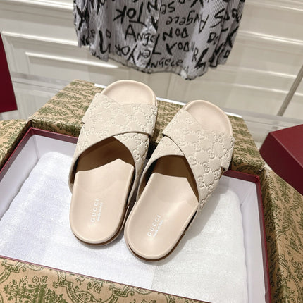 GG SLIDES IN NUDE BEIGE SUEDE WITH EMBOSSED LOGO STYLE 7