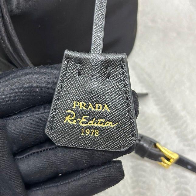 BUCKET BAG 19 IN BLACK RE-NYLON AND CALFSKIN HANDLE