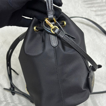 BUCKET BAG 19 IN BLACK RE-NYLON AND CALFSKIN HANDLE