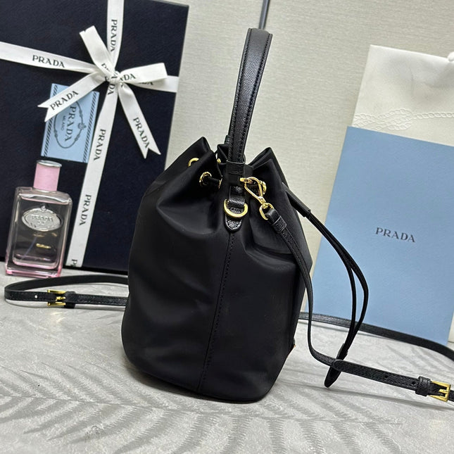 BUCKET BAG 19 IN BLACK RE-NYLON AND CALFSKIN HANDLE