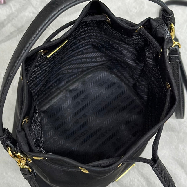 BUCKET BAG 19 IN BLACK RE-NYLON AND CALFSKIN HANDLE
