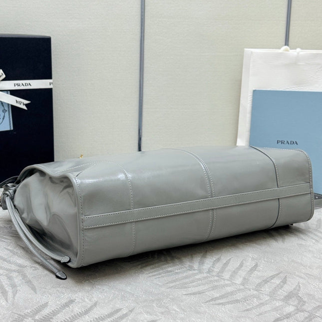 PRADA 25S LUX SOFT BAG 42 IN GRAY GLOSSY CALFSKIN GOLD HARDWRE