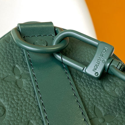 KEEPALL BANDOULIÈRE 25 IN FOREST GREEN MONOGRAM EMBOSSED CALFSKIN