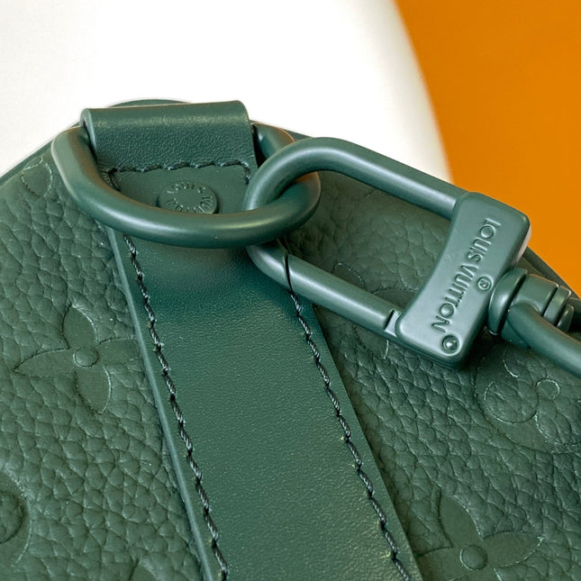 KEEPALL BANDOULIÈRE 25 IN FOREST GREEN MONOGRAM EMBOSSED CALFSKIN