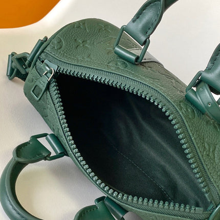 KEEPALL BANDOULIÈRE 25 IN FOREST GREEN MONOGRAM EMBOSSED CALFSKIN
