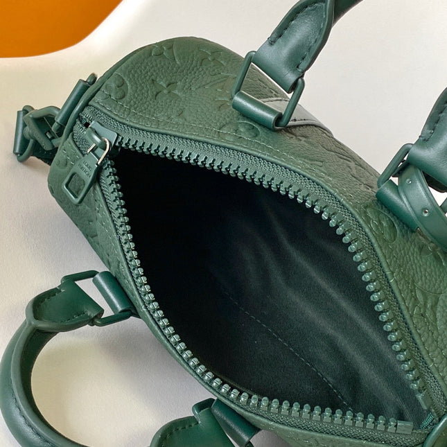 KEEPALL BANDOULIÈRE 25 IN FOREST GREEN MONOGRAM EMBOSSED CALFSKIN