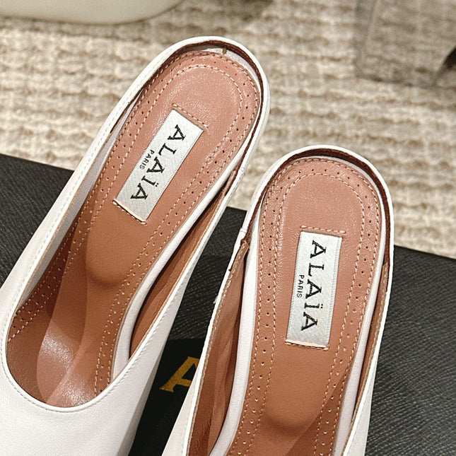 ALAIA SPIKE JEWEL MULES IN WHITE CALFSKIN