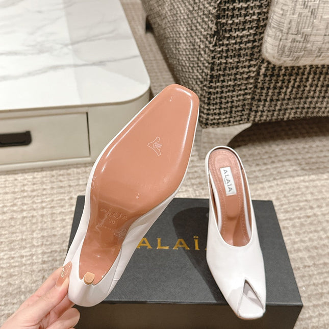 ALAIA SPIKE JEWEL MULES IN WHITE CALFSKIN
