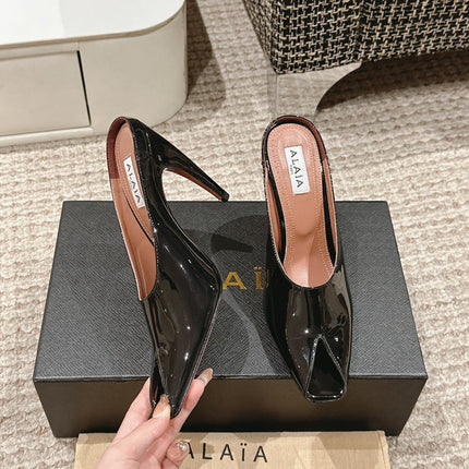 ALAIA SPIKE JEWEL MULES IN BLACK GLOSSY CALFSKIN