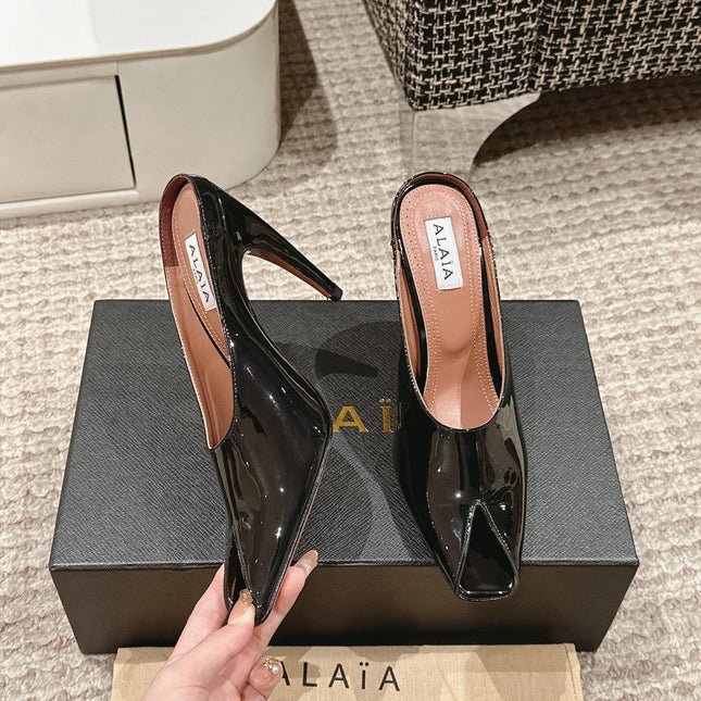 ALAIA SPIKE JEWEL MULES IN BLACK GLOSSY CALFSKIN