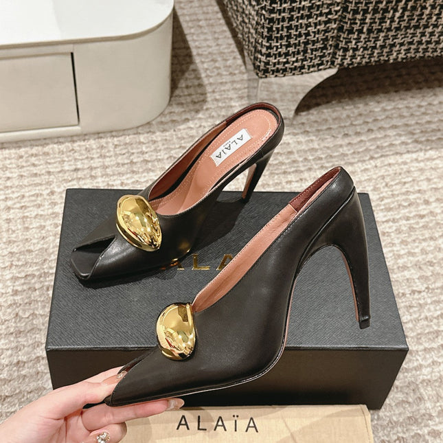 ALAIA SPIKE JEWEL MULES IN BLACK CALFSKIN WITH GOLD HARDWARE