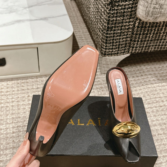 ALAIA SPIKE JEWEL MULES IN BLACK CALFSKIN WITH GOLD HARDWARE