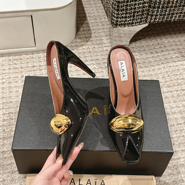 ALAIA SPIKE JEWEL MULES IN BLACK GLOSSY CALFSKIN WITH GOLD HARDWARE