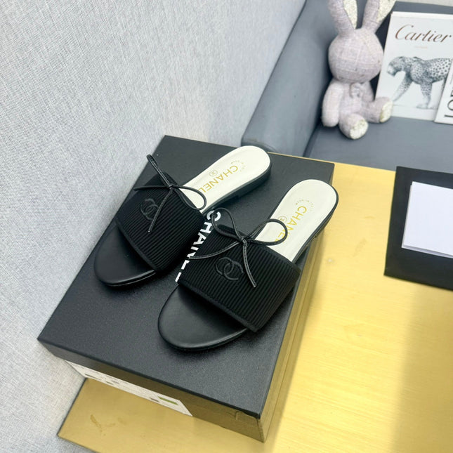 BOW SLIPPERS IN BLACK LAMBSKIN