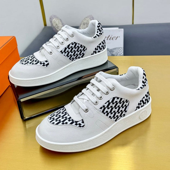 FREE SNEAKER IN WHITE CALFSKIN AND "H EN BIAIS" BLACK CANVAS