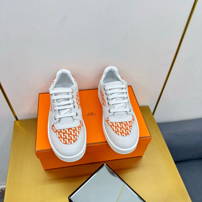FREE SNEAKER IN WHITE CALFSKIN AND "H EN BIAIS" ORANGE CANVAS
