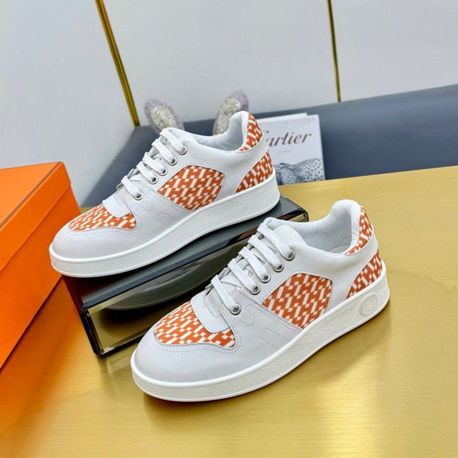 FREE SNEAKER IN WHITE CALFSKIN AND "H EN BIAIS" ORANGE CANVAS