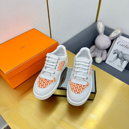 FREE SNEAKER IN WHITE CALFSKIN AND "H EN BIAIS" ORANGE CANVAS