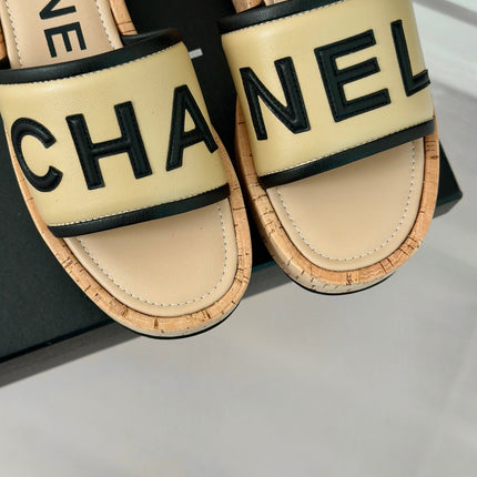 THICK SOLE LETTER SLIPPERS IN DARK CREAM SHEEPSKIN