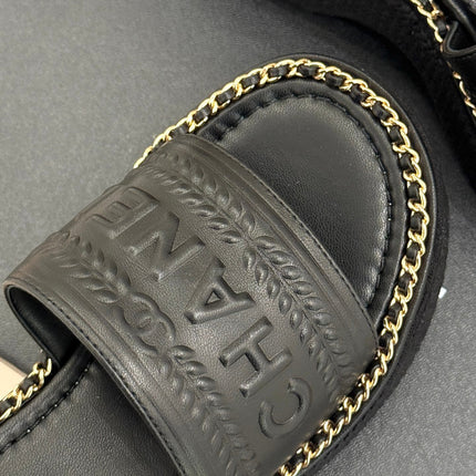 THICK SOLE WEDGE SLIPPERS IN BLACK CALFSKIN