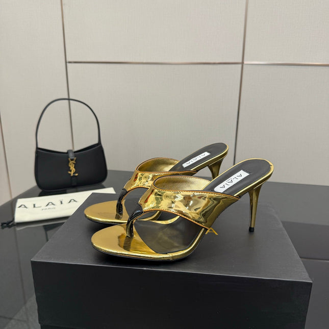 ALAIA HEELED THONG 25S IN GOLD PATENT LEATHER