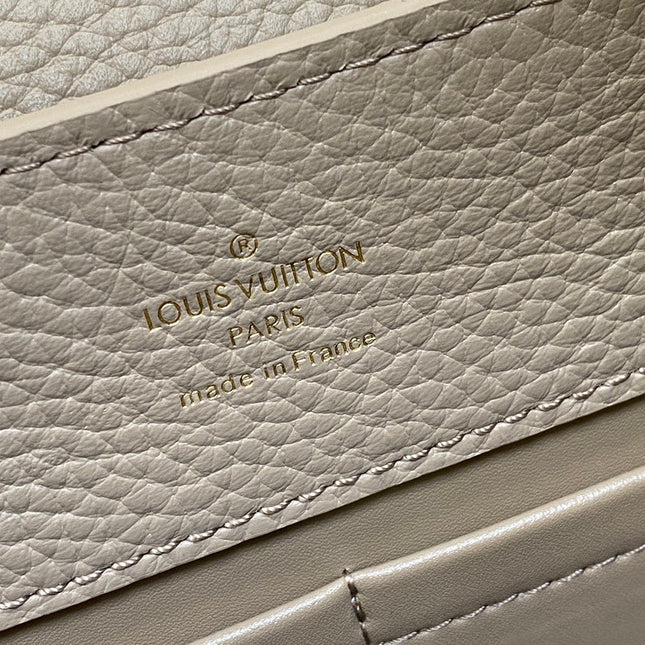 CAPUCINES MM 31 IN KHAKI BROWN TAURILLON