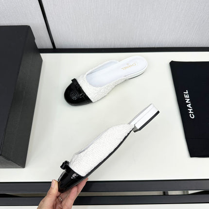 BOW MULE IN WHITE FUR AND BLACK CALFSKIN