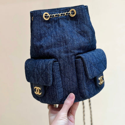 DRAWSTRING BUCKET BACKPACK 24 IN DARK BLUE DENIM GOLD HARDWARE