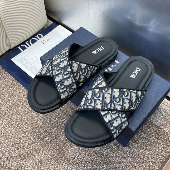 DIOR 25S ALIAS CROSS-STRAP SLIDES IN BLACK CALFSKIN WITH CD OBLIQUE DEEP BLUE LOGO