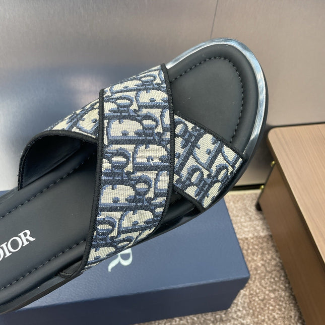 DIOR 25S ALIAS CROSS-STRAP SLIDES IN BLACK CALFSKIN WITH CD OBLIQUE DEEP BLUE LOGO