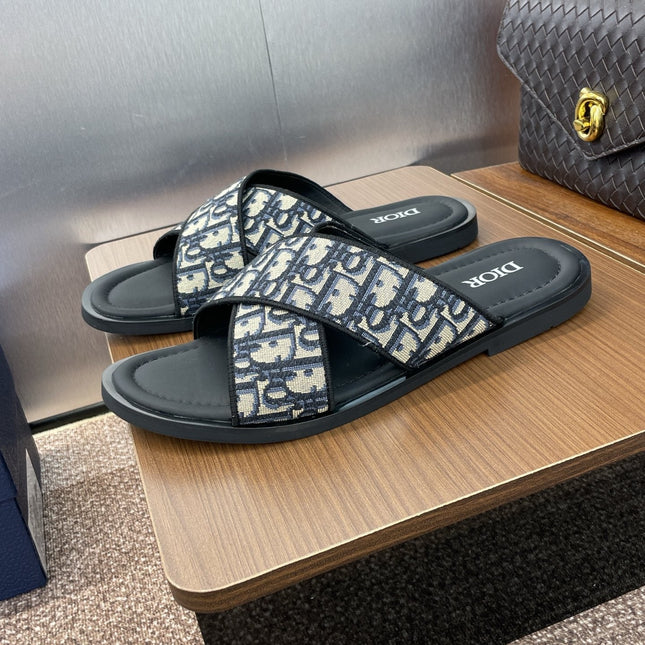 DIOR 25S ALIAS CROSS-STRAP SLIDES IN BLACK CALFSKIN WITH CD OBLIQUE DEEP BLUE LOGO