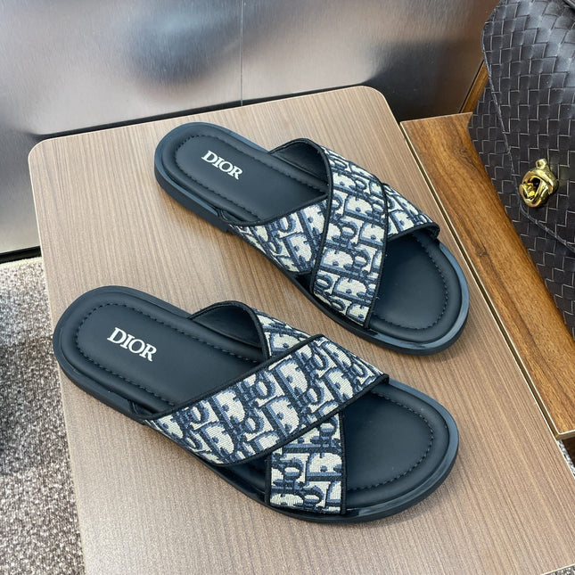 DIOR 25S ALIAS CROSS-STRAP SLIDES IN BLACK CALFSKIN WITH CD OBLIQUE DEEP BLUE LOGO