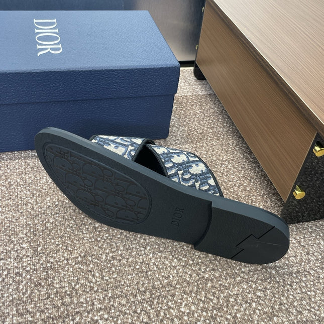 DIOR 25S ALIAS CROSS-STRAP SLIDES IN BLACK CALFSKIN WITH CD OBLIQUE DEEP BLUE LOGO