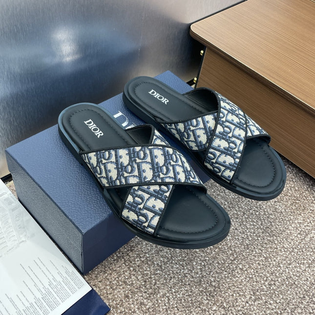 DIOR 25S ALIAS CROSS-STRAP SLIDES IN BLACK CALFSKIN WITH CD OBLIQUE DEEP BLUE LOGO