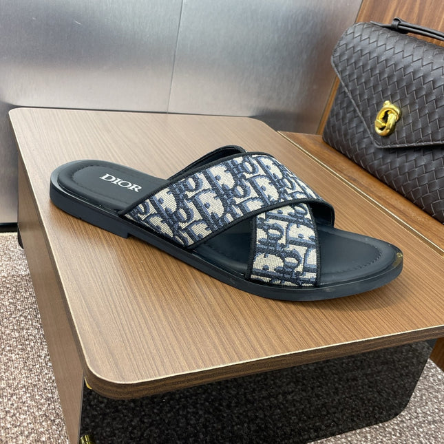 DIOR 25S ALIAS CROSS-STRAP SLIDES IN BLACK CALFSKIN WITH CD OBLIQUE DEEP BLUE LOGO