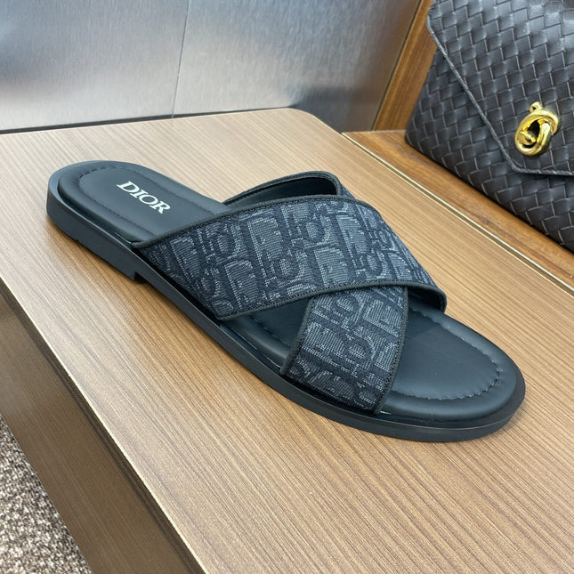 DIOR 25S ALIAS CROSS-STRAP SLIDES IN BLACK CALFSKIN WITH CD OBLIQUE DARK BLUE LOGO