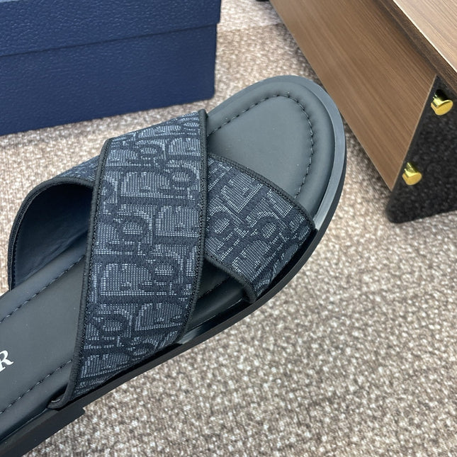 DIOR 25S ALIAS CROSS-STRAP SLIDES IN BLACK CALFSKIN WITH CD OBLIQUE DARK BLUE LOGO