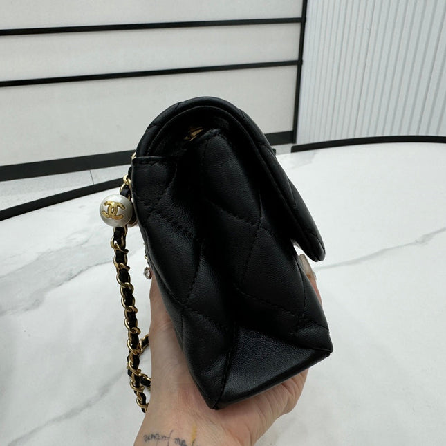 CHANEL 25S FLAP BAG 19 CM IN BLACK LAMBSKIN WITH PEARL TOP HANDLE