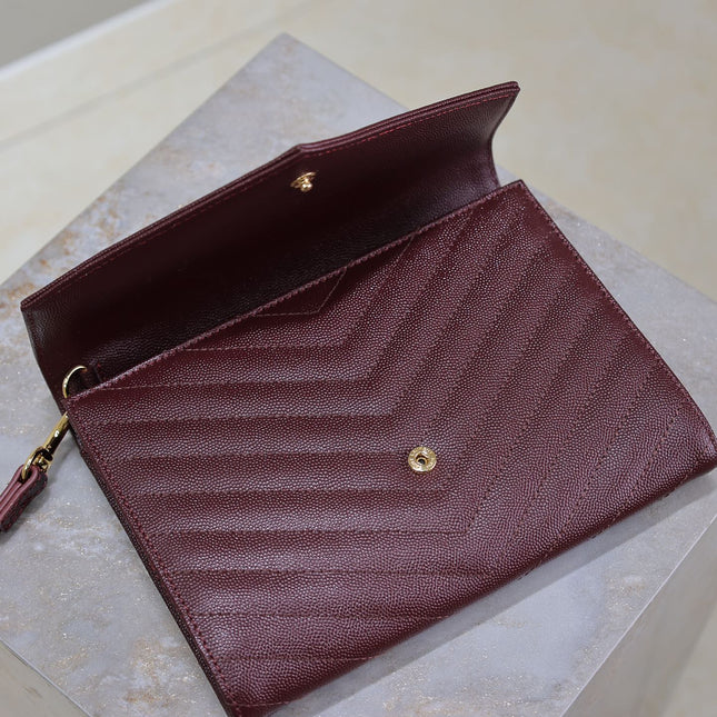 CASSANDRE CLUTCH 21 IN BORDEAUX RED LAMBSKIN GOLD HARDWARE