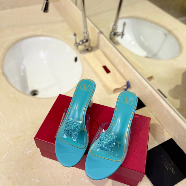 HIGH MULE 60MM IN AQUA BLUE SHEEPSKIN AND TRANSPARENT PVC